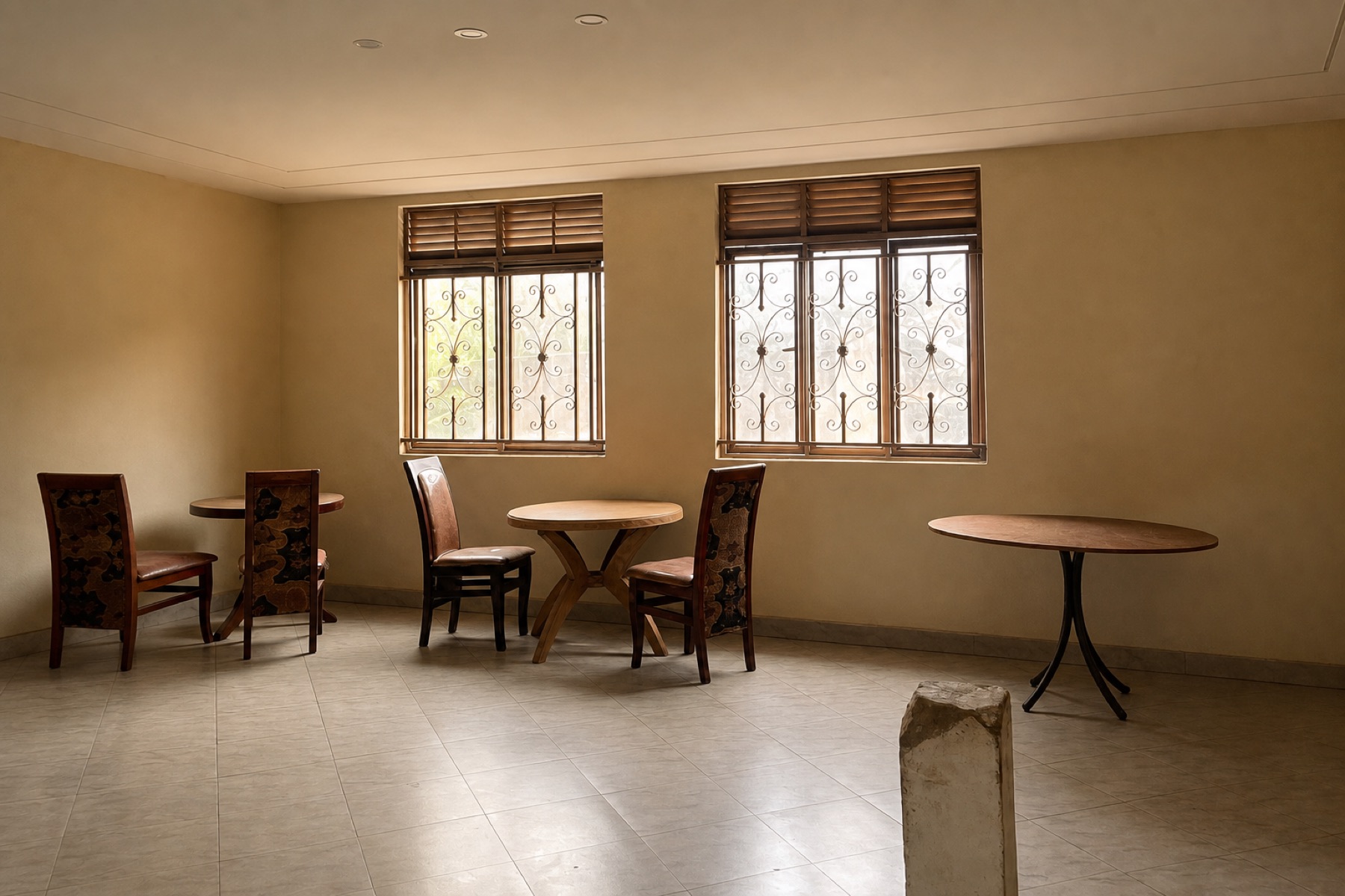 The multipurpose room at Maganjo, set with tables by the windows