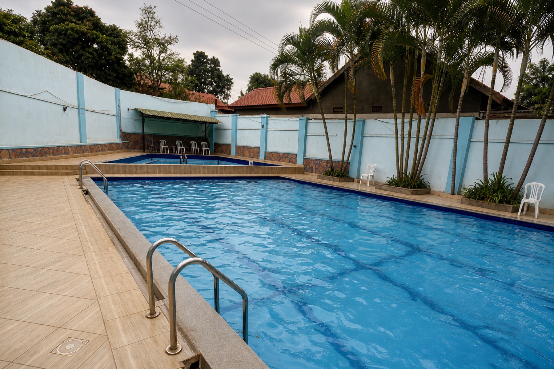 The main pool at Maganjo, with loungers along the far wall